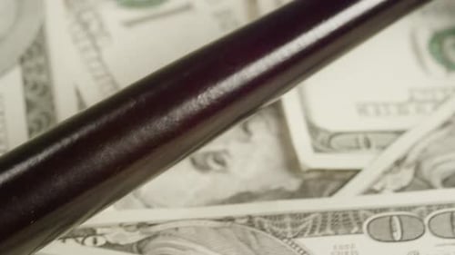 Gavel Resting on Stack of Money