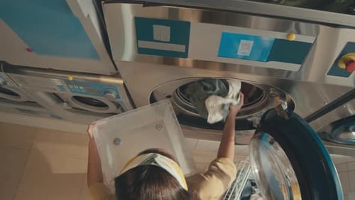 Doing Laundry in Self-Service Public Laundry or Washateria