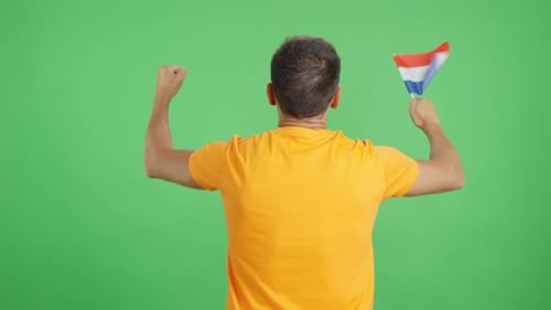 Rear View of a Man Waving a Dutch Pennant