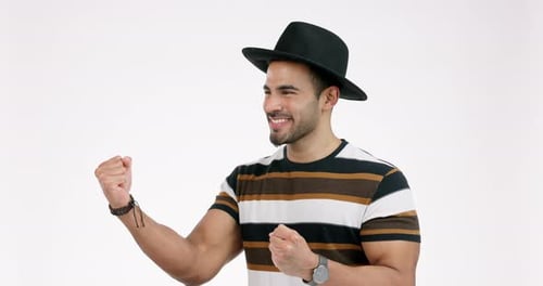 Happy, celebration and man with winning fist in studio for good news, deal