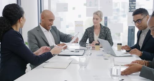 4k video footage of businesspeople signing paperwork and applauding during a meeting in an office