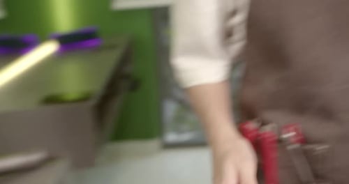 Man Getting a Haircut in a Barber Shop