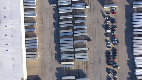 Aerial View of a Logistics Hub with Parked Semi Trailers