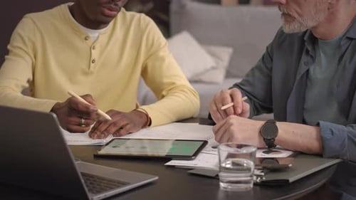 Team Analyzing Financial Planning on a Tablet