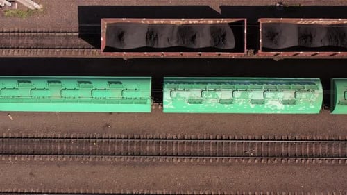 Top View of Fast Moving Train with Green Wagons