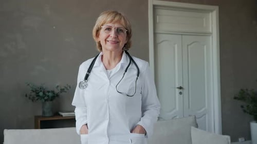 Friendly Doctor with Stethoscope in Clean Interior