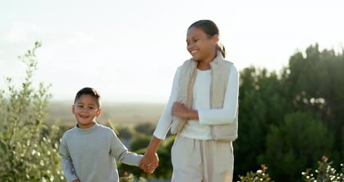 Children, boy and girl in park, holding hands and walking together with smile on face in summer