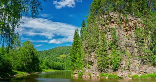 A Timelapse of a Mountain River and Clouds