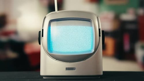 Retro Television Showing Static with Antenna in Home