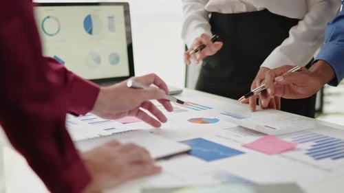 Close up of business hands are working and brainstorming on paperworks.