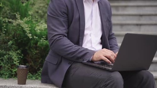 Businessman Typing on the Laptop While Working Outdoors Close Up Slow Motion