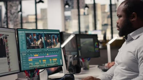 Black Videographer Editing Raw Video Footage and Adjusting Sliders on Software