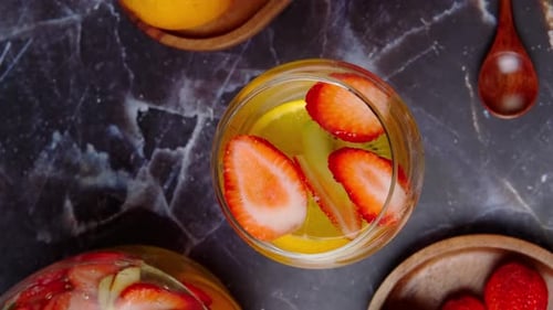 A Glass Cup With A White Clericot Cocktail, Aerial View, Camera Rotating