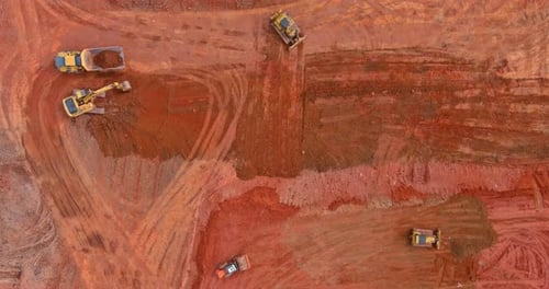 Aerial View of Heavy Construction Equipment on Dirt