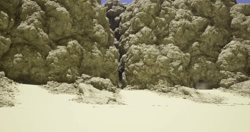 Rocky Canyon Landscape with Sandy Foreground Under Clear Sky