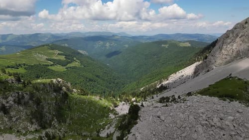 Beautiful epic rocks with scatterings of stones and coniferous trees. Mountains Komovi. Montenegro.