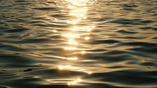 The sea's surface glittered with sparks.