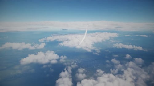 Military Jet Flying Through Clouds on a Sunny Day