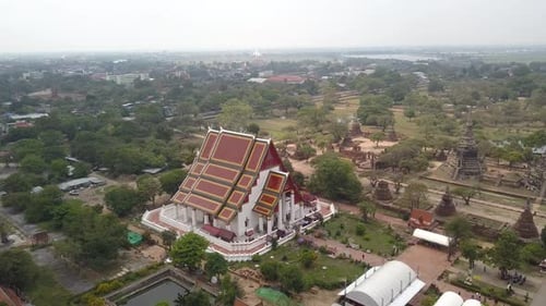 4K AERIAL DOLLY FORWARD VIEW of incredible buddhist temple in Ayutthaya, Mongkhon Bophit, Thailand,