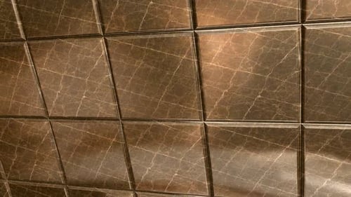 Dunkle Marmorfliesen von Emperador mit poliertem Blendeffekt und luxuriösem braunem Steinmotion-Hintergrund