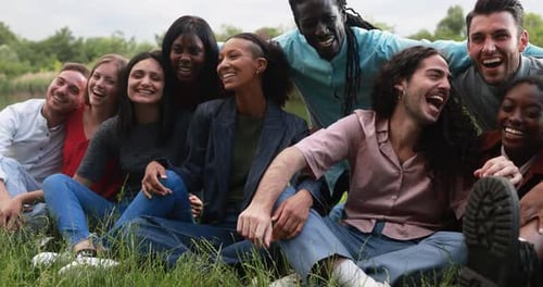 Diverse Group of Friends Laughing Together in Park