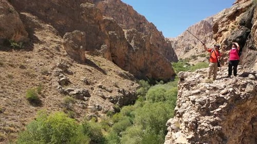 Aerial View Of Two Climbers Watching Around The Canyon