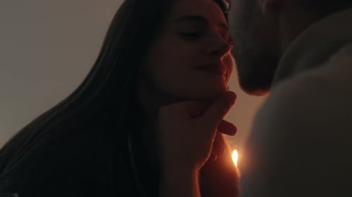 Romantic Couple Embracing in Warm Indoor Light