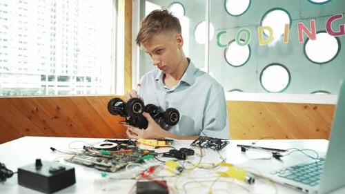 Teen Builds Robotic Car in Classroom Setting