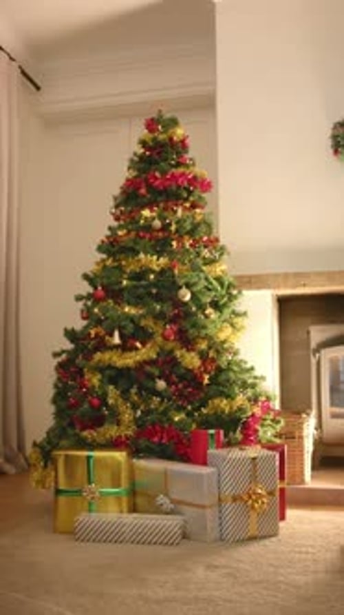 Decorated Christmas Tree with Wrapped Presents in Home