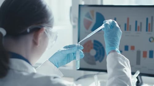 Scientist Using Pipette in Modern Laboratory