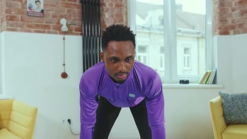 Man Exercising with Resistance Bands at Home