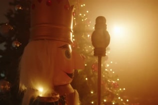 Nutcracker Near the Tree in Christmas Sunny Day