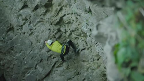 Extreme Sports Active Alpinist Male Sportsman Climbing Down the Mountain Cliff Limestone Rock