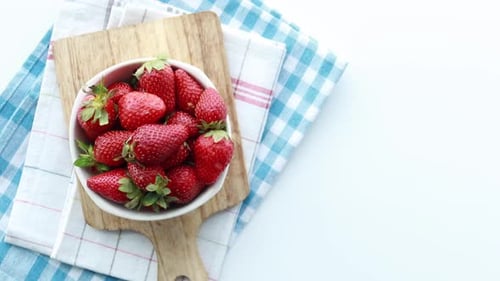 Ripe Red Strawberries in a Bowl on Table