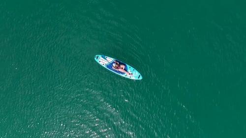 Aerial View Scenic Paddleboard Adventure in the Green Canyon People Swimming and Relaxing