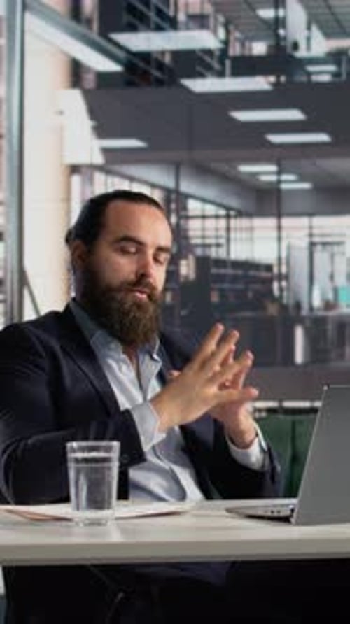 Man in Suit in Office Video Call