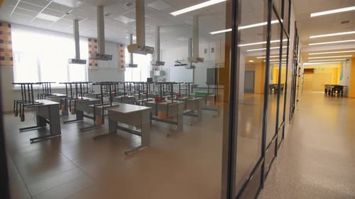 Classroom with Desks Chairs and Glass Wall in School
