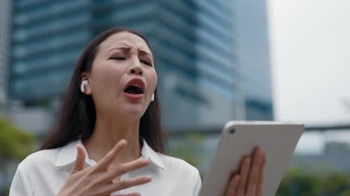 Frustrated Woman Arguing on Tablet Video Call