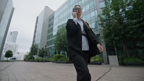 Female Executive Walking to a Business Center Office