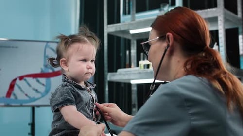 Doctor Examining a Baby with a Stethoscope