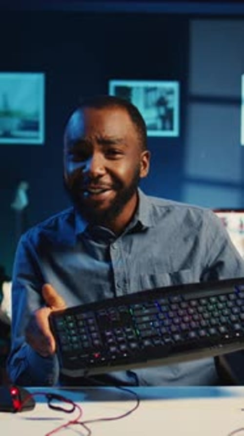 Young Adult Presenting Computer Equipment and Webcasting