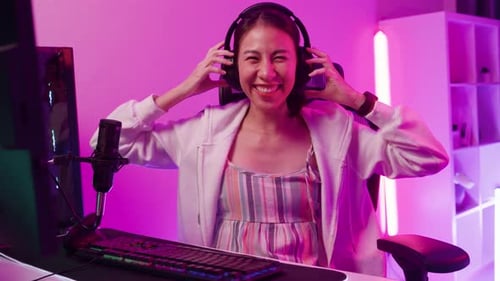 Excited Woman Celebrates Gaming Win at Home