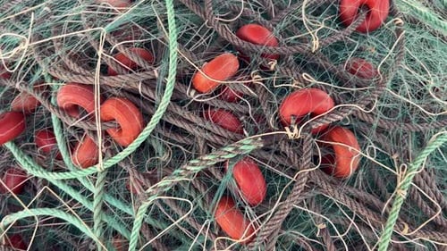 Tangled Fishing Net with Orange Floats Close-up