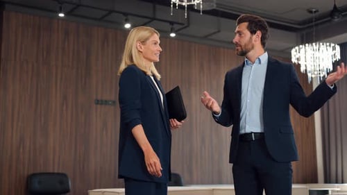 Business Colleagues Meeting and Handshake in Lobby