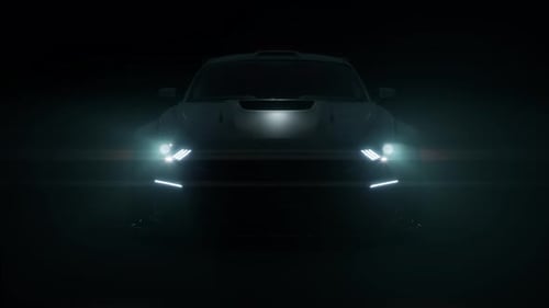 Front View Silhouette Car With Headlights On Dark Black Background