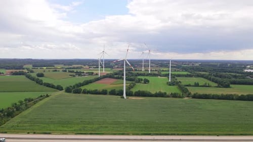 Wind turbines next to highway