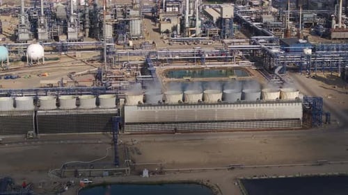 Industrial Facility Aerial View Featuring Tanks and Buildings