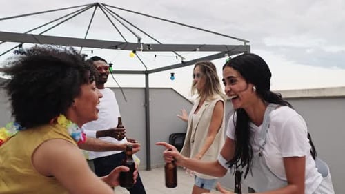 Friends Laugh and Dance on City Rooftop Party