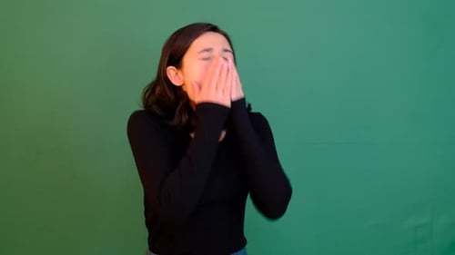 Woman Sneezing Repeatedly in Front of Green Screen
