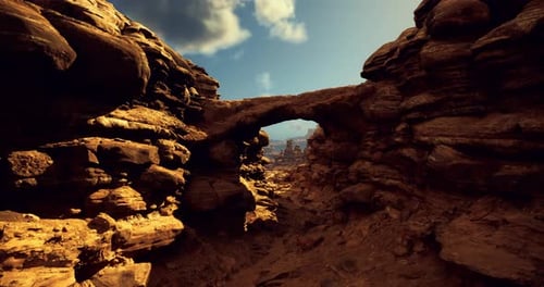 Explore Scenic Rock Formations Under a Clear Sky in a Desert Landscape